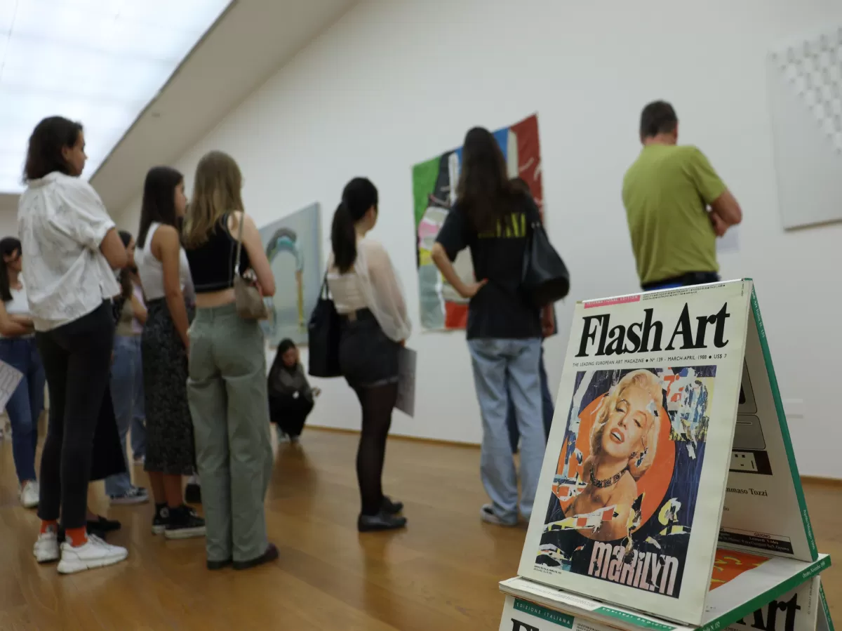 Group of international students watching an art work