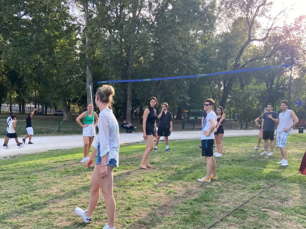 Group of international students playing volleyball