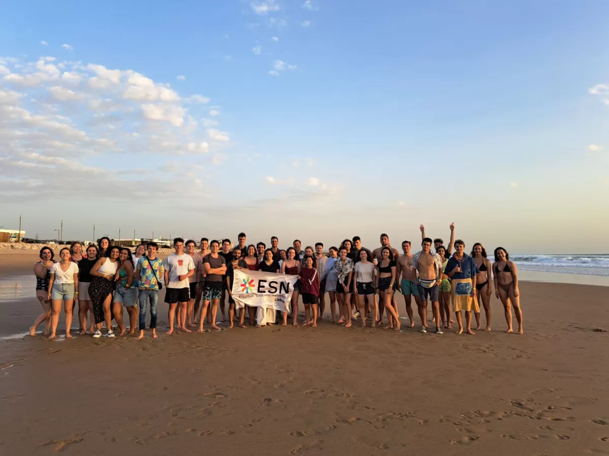 Group photo of the participants at the beach