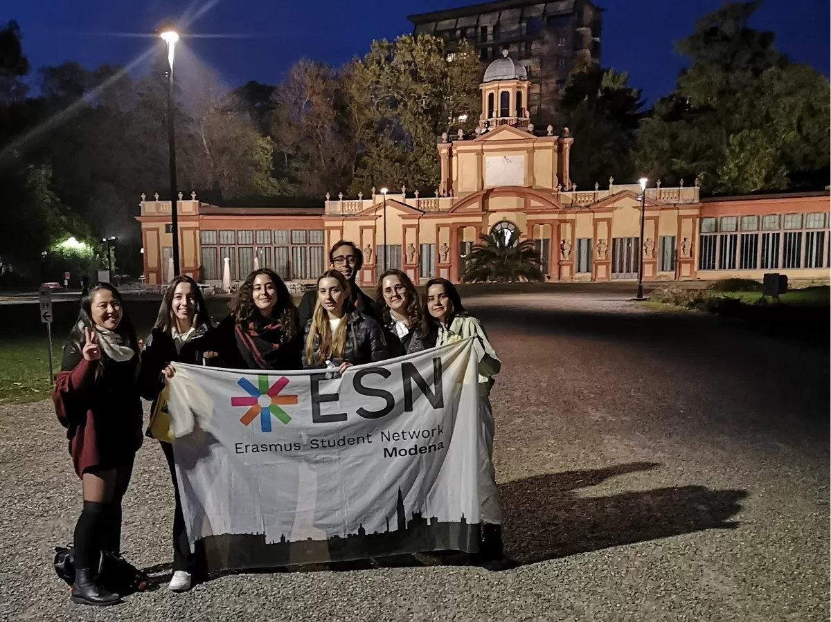 International students and coordinator in front of the last location