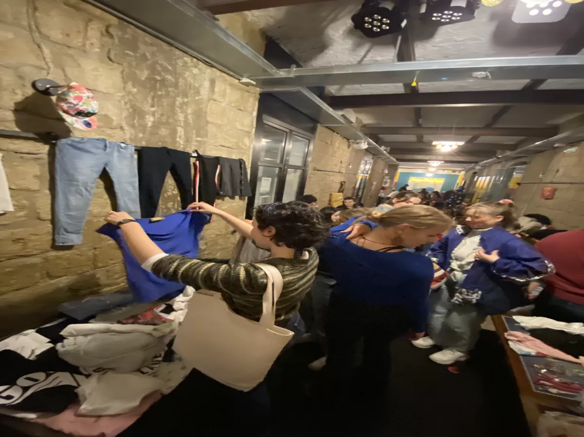 Group of international students buying clothes