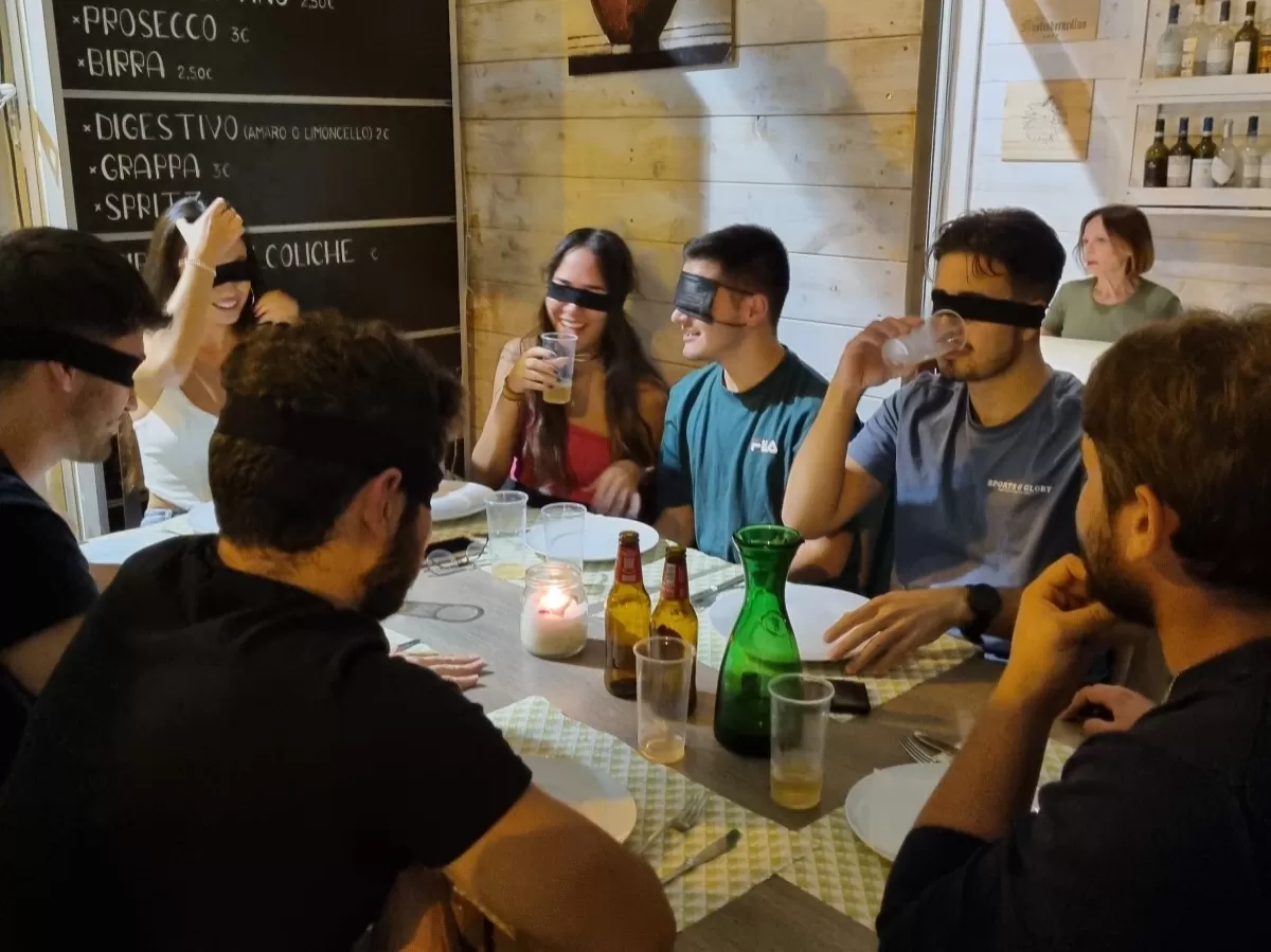 People having dinner blindfolded.