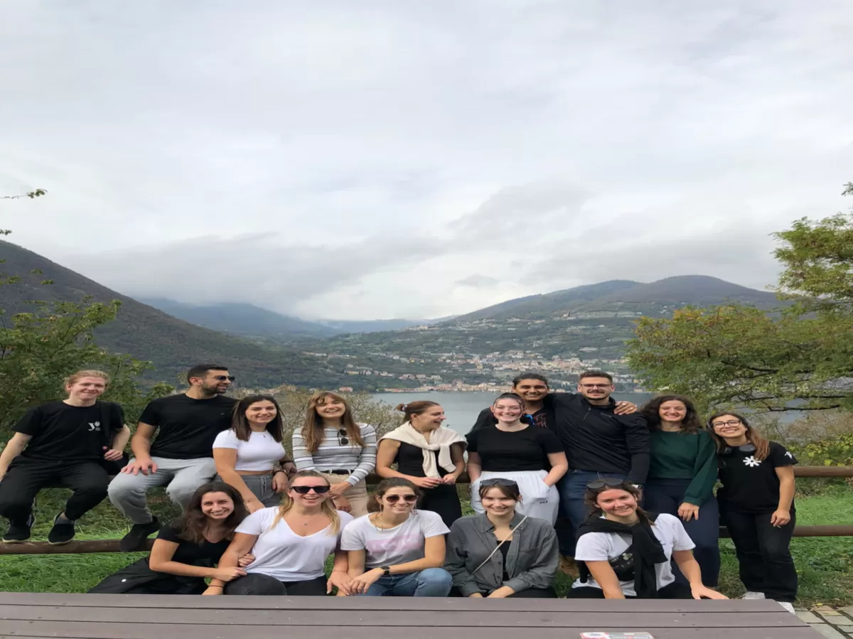 Erasmus students and esn members taking a picture with a beautiful landscape