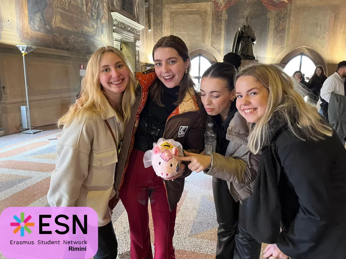 some Erasmus girls showing Carlotta - the ESN Rimini Mascotte - inside a museum in Bologna