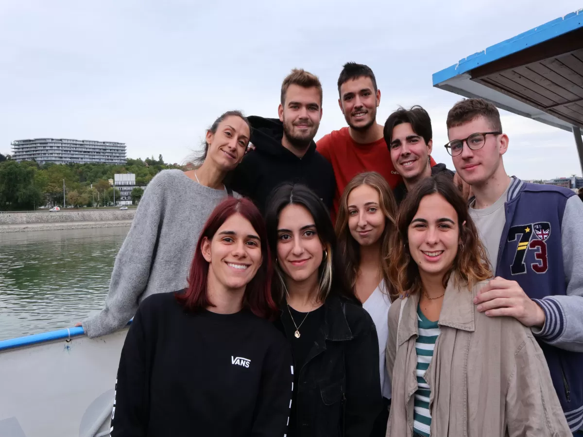 8 people smiling on the ship