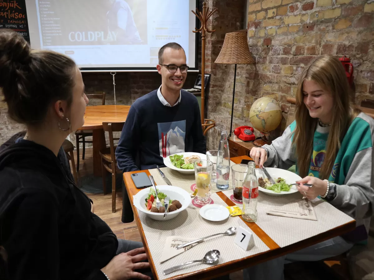 3 people around a table