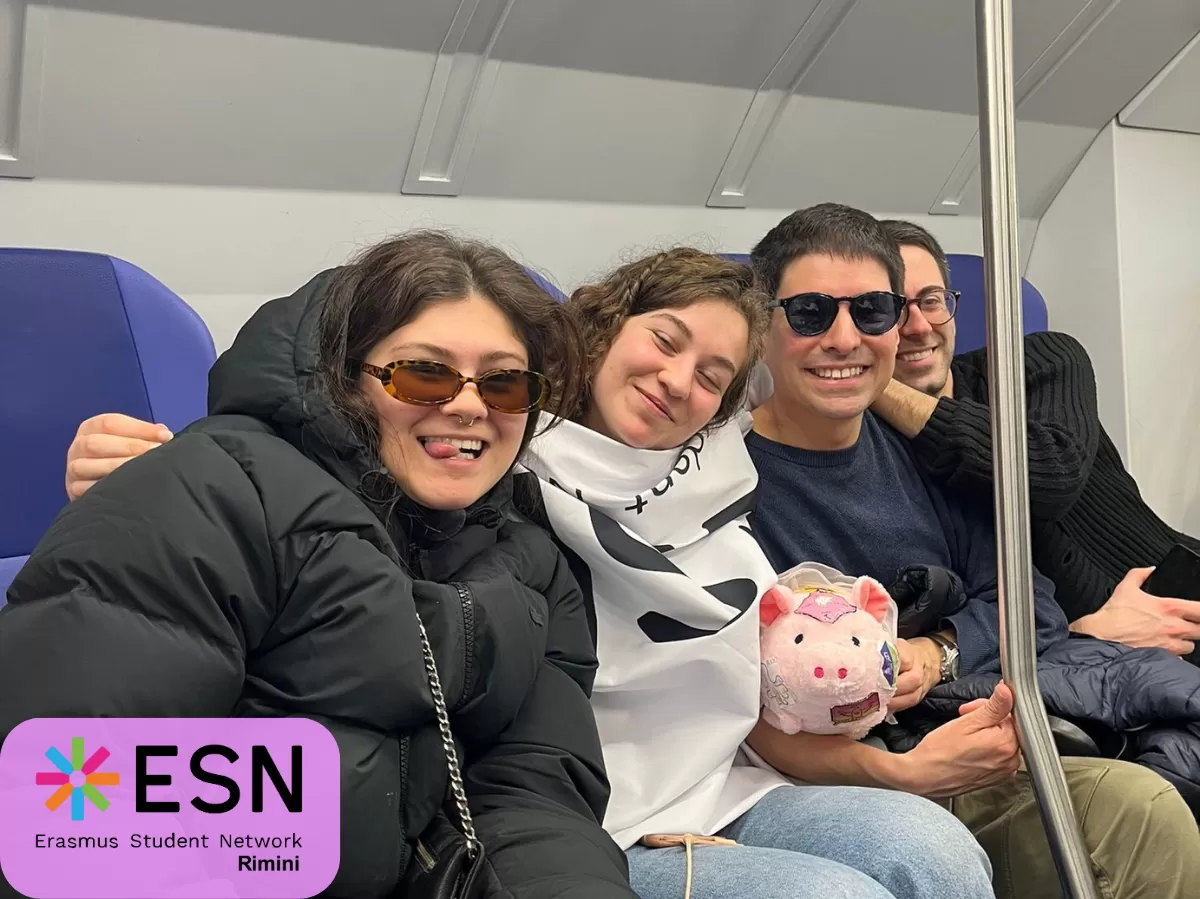 some Erasmus students and Esn volunteers on the train to Bologna with our Esn mascotte - Carlotta.