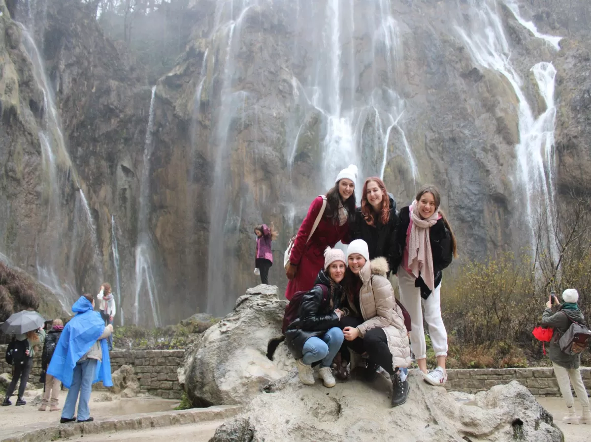 Students in front of waterfalls
