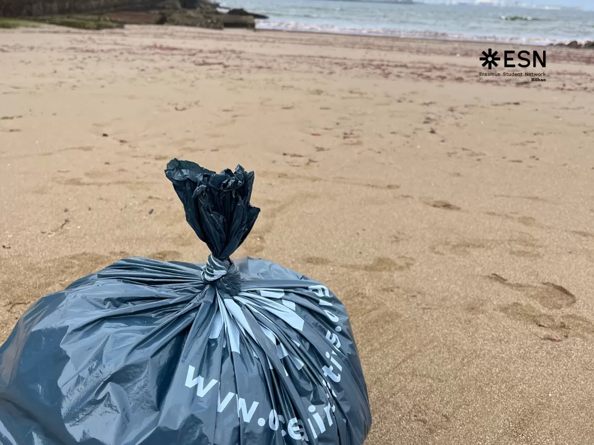 One bag of trash with the clean beach