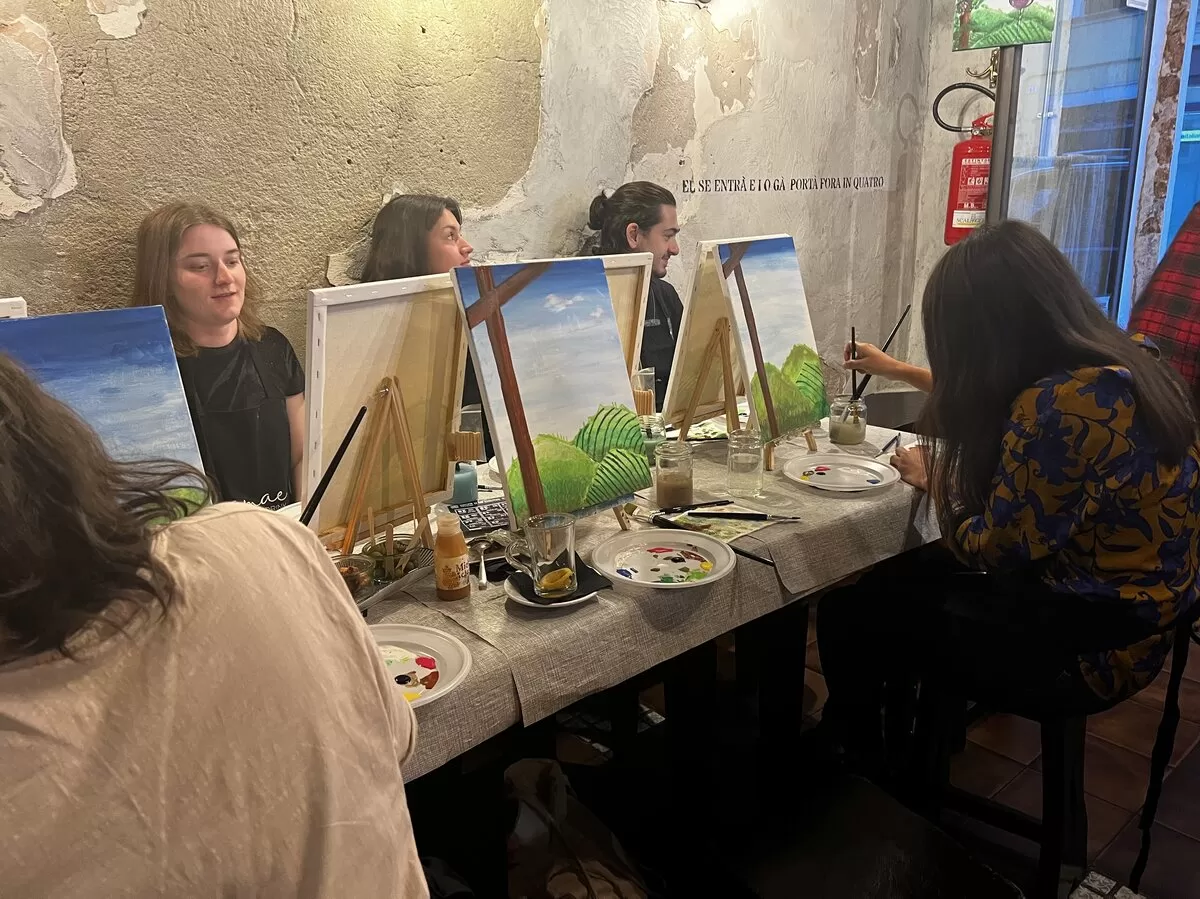 Group of international students doing a painting session to improve mindfulness