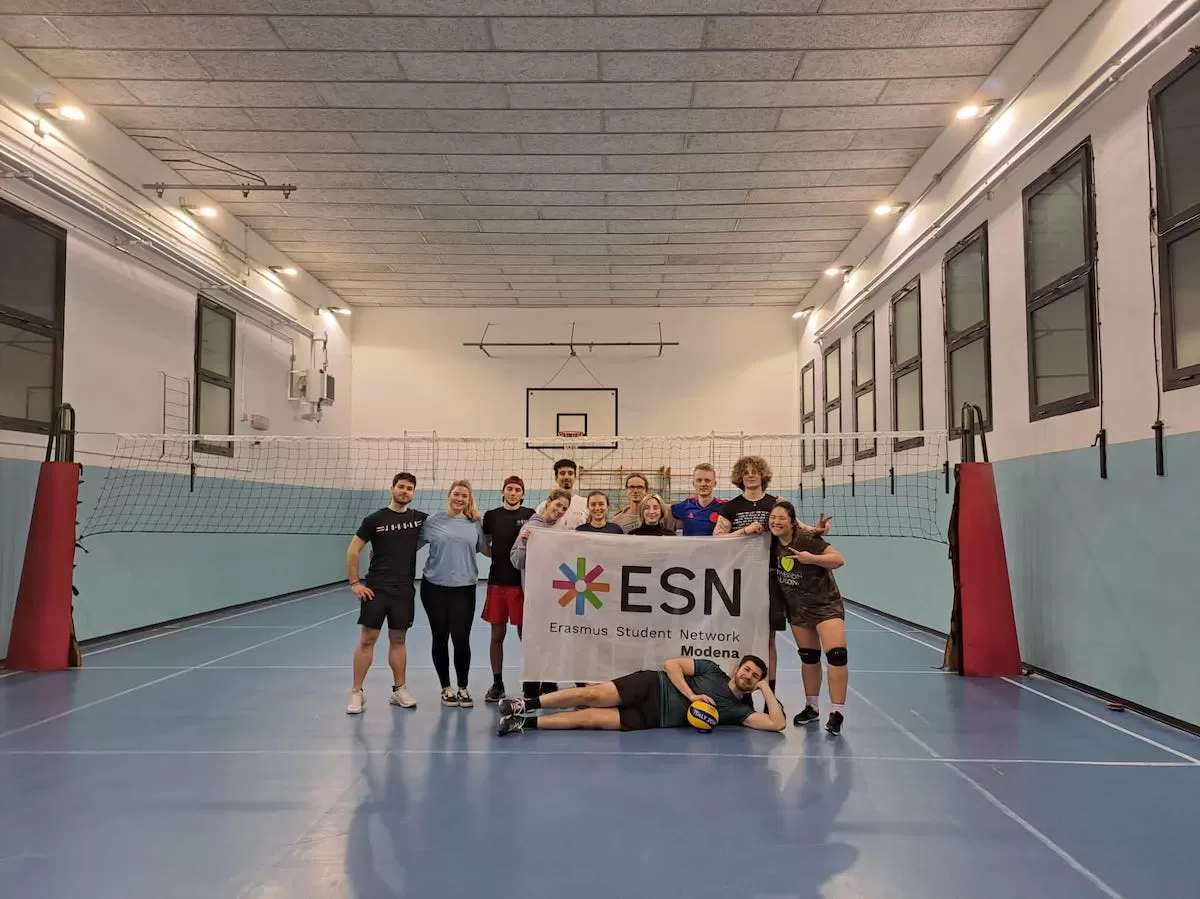 People after playing volleyball with ESN flag