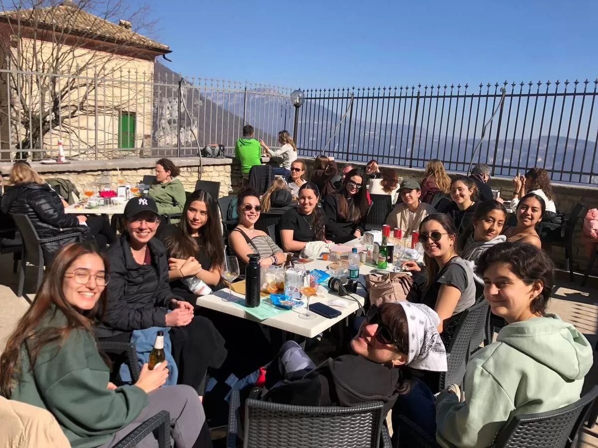 Group of international students having lunch at the Madonna della Corona Sanctuary