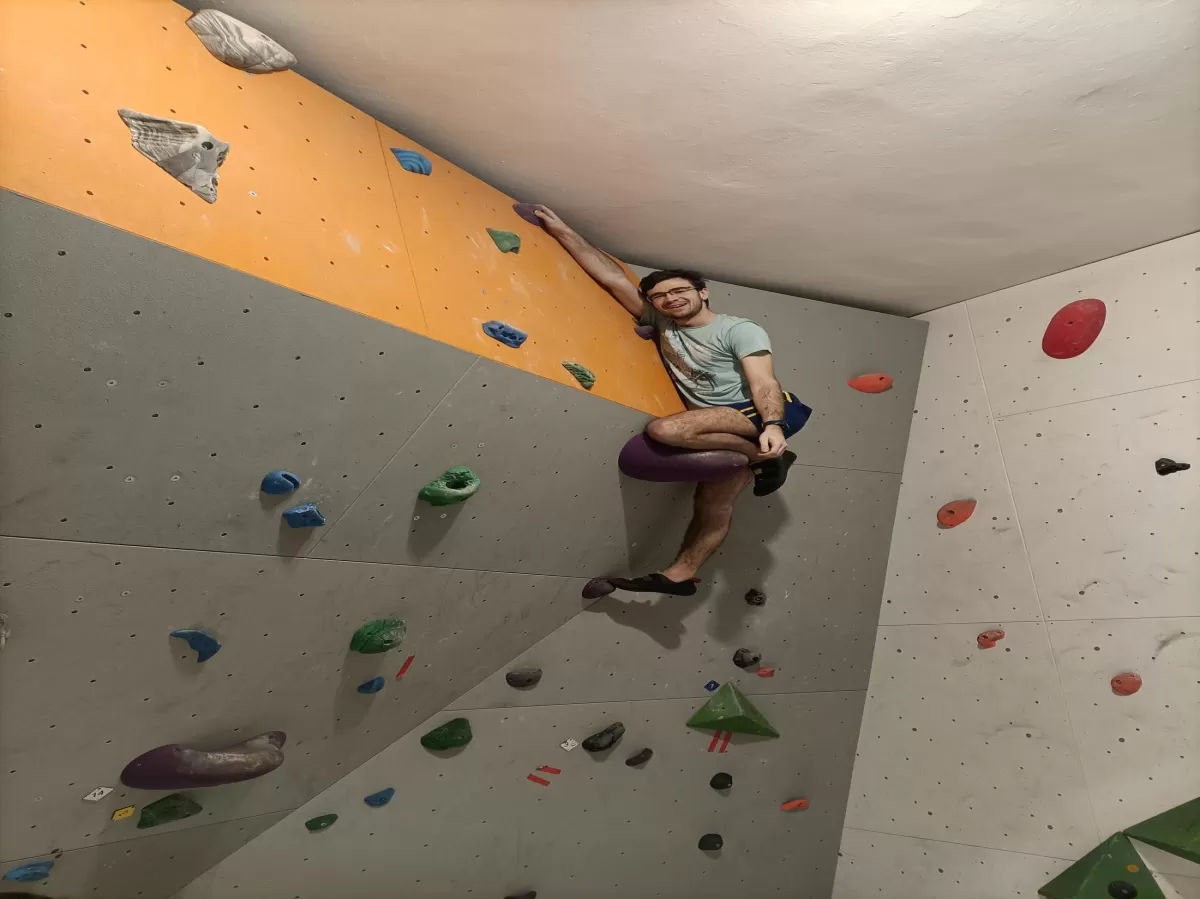 Reaching the peak of the boulder wall
