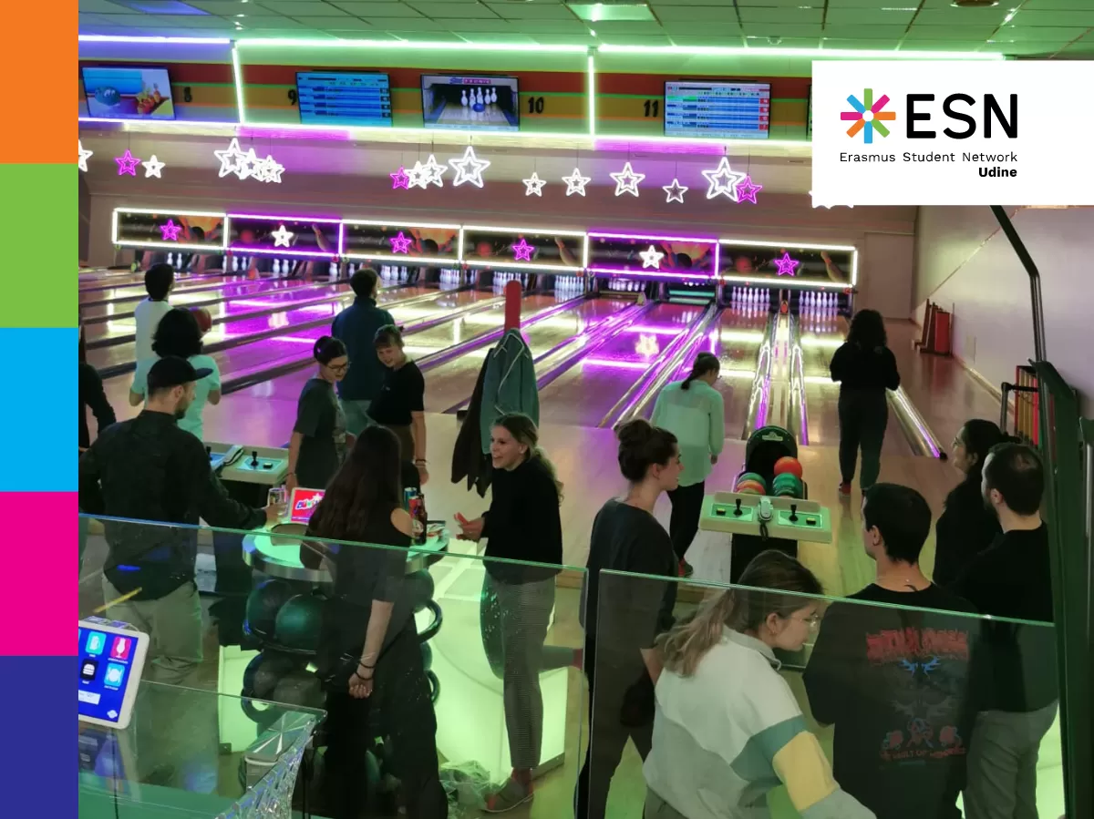 Participants chatting with each other at the bowling alley