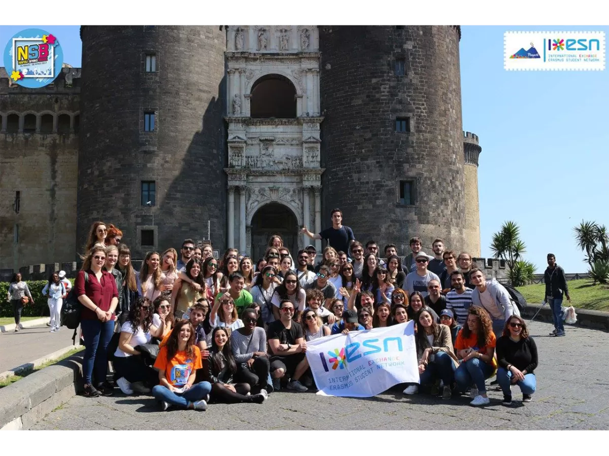 A photo group taken in front of Maschio Angioino while showing the ESN's flag