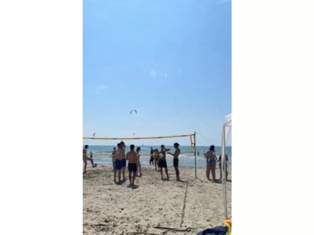 esners and international students plating volleyball