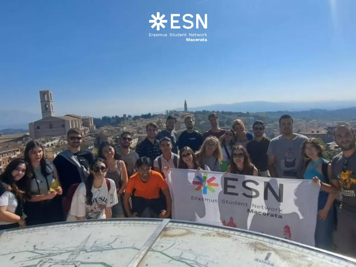 Group photo with the ESN flag and with the panorama of the city of Perugia in the background.