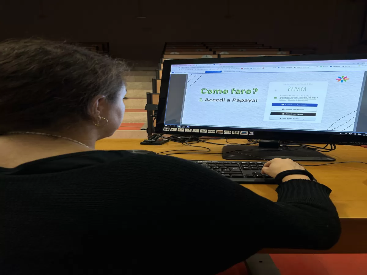 Computer with the powerpoint presentation and an ESN volunteer