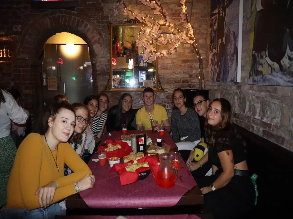 Group of international students around the bar table