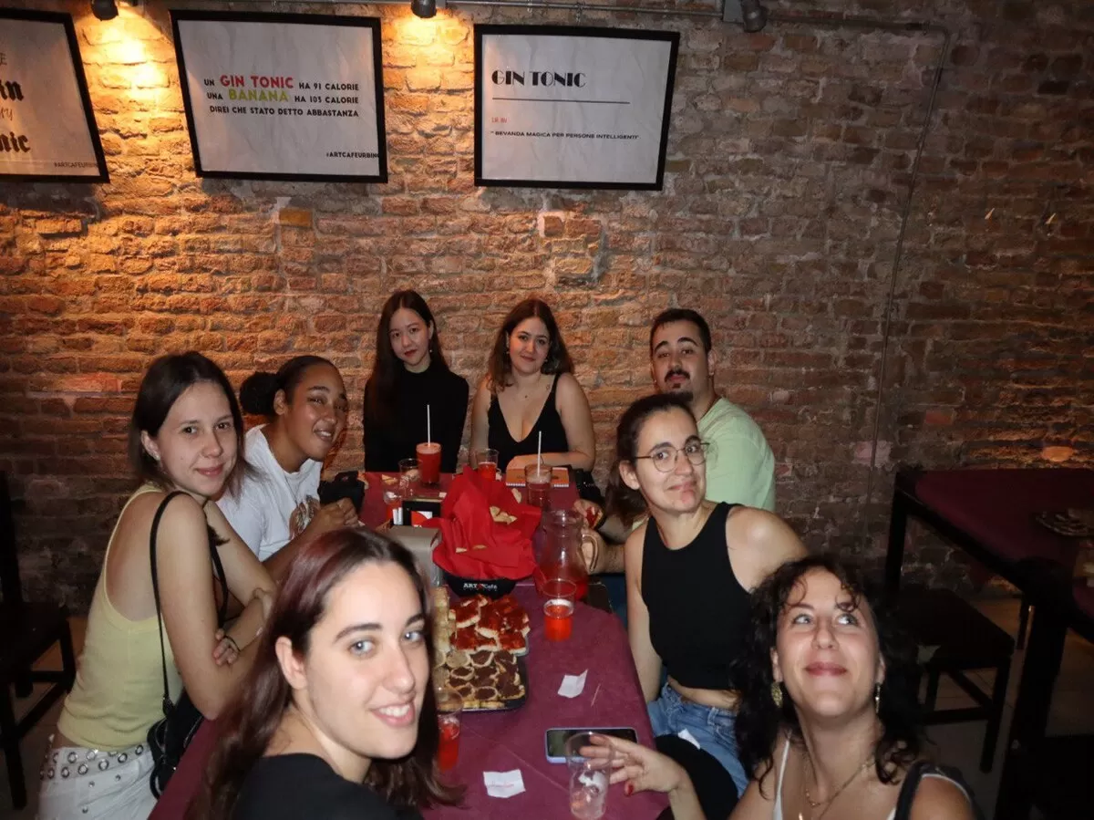 Group of international students around the bar table