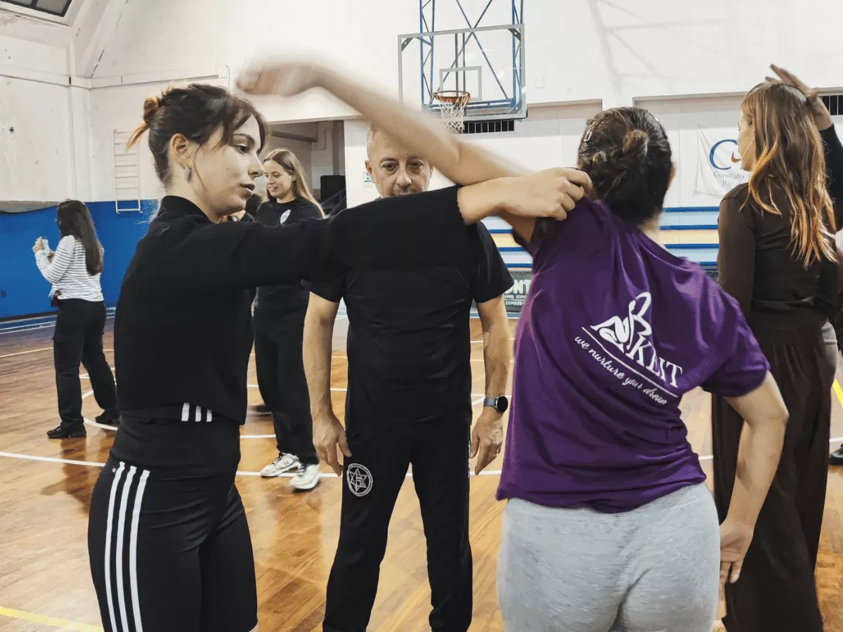 Participants practicing self defense techniques.