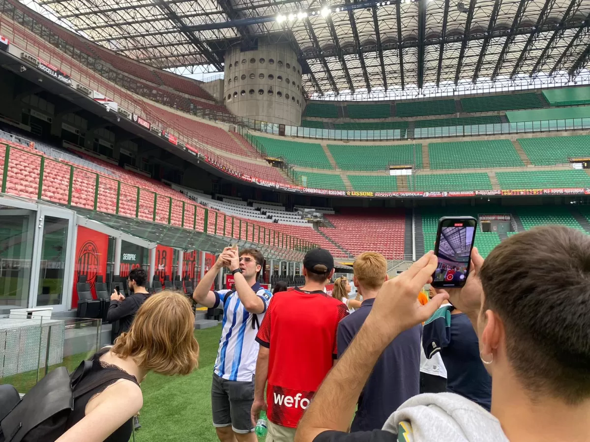 Erasmus students taking picture of the view from the field