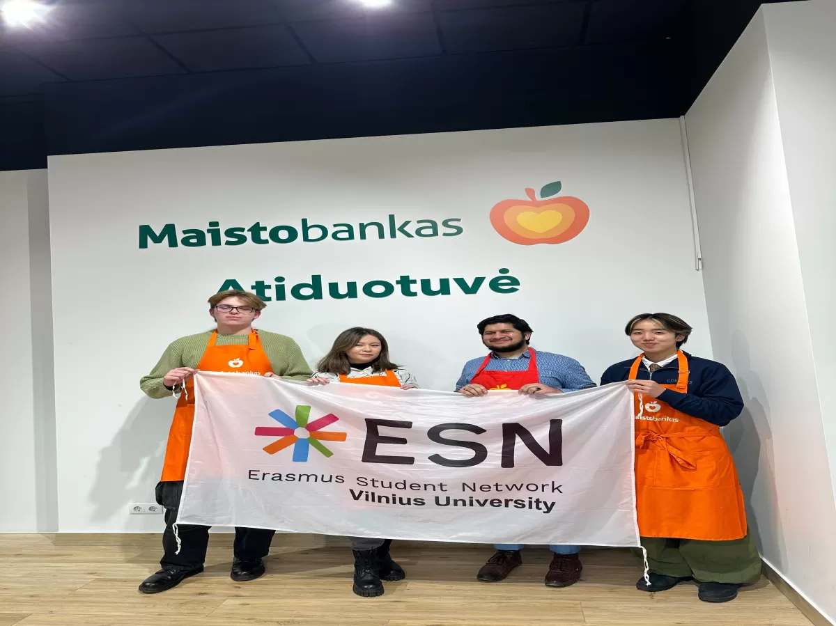 Part of the group who helped with the event posing for the photo with an ESN VU flag