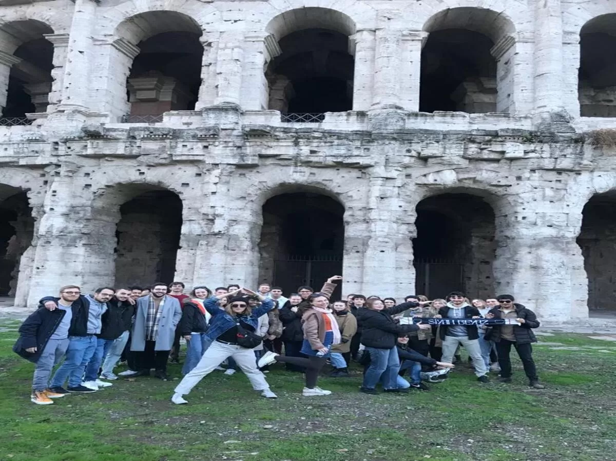 group foto in front of Teatro Marcello, and erasmus doing "ASE" with their bodies
