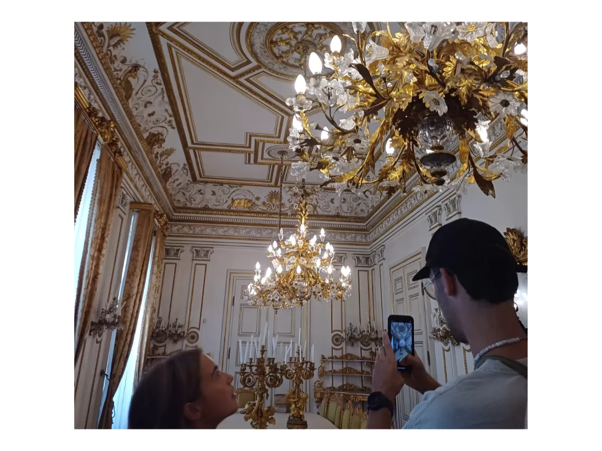 Two Erasmus students taking pictures of one of the museum's rooms