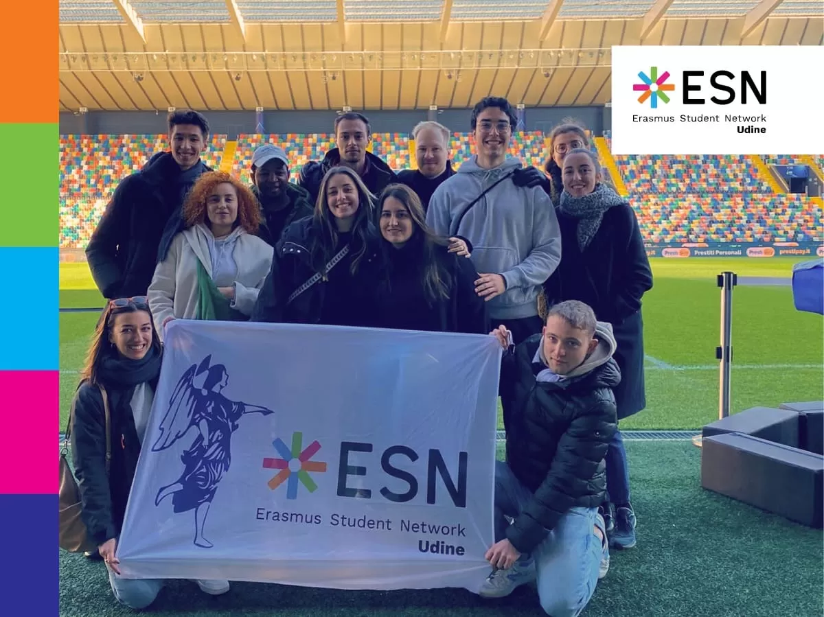 the group on the football field with ESN flag