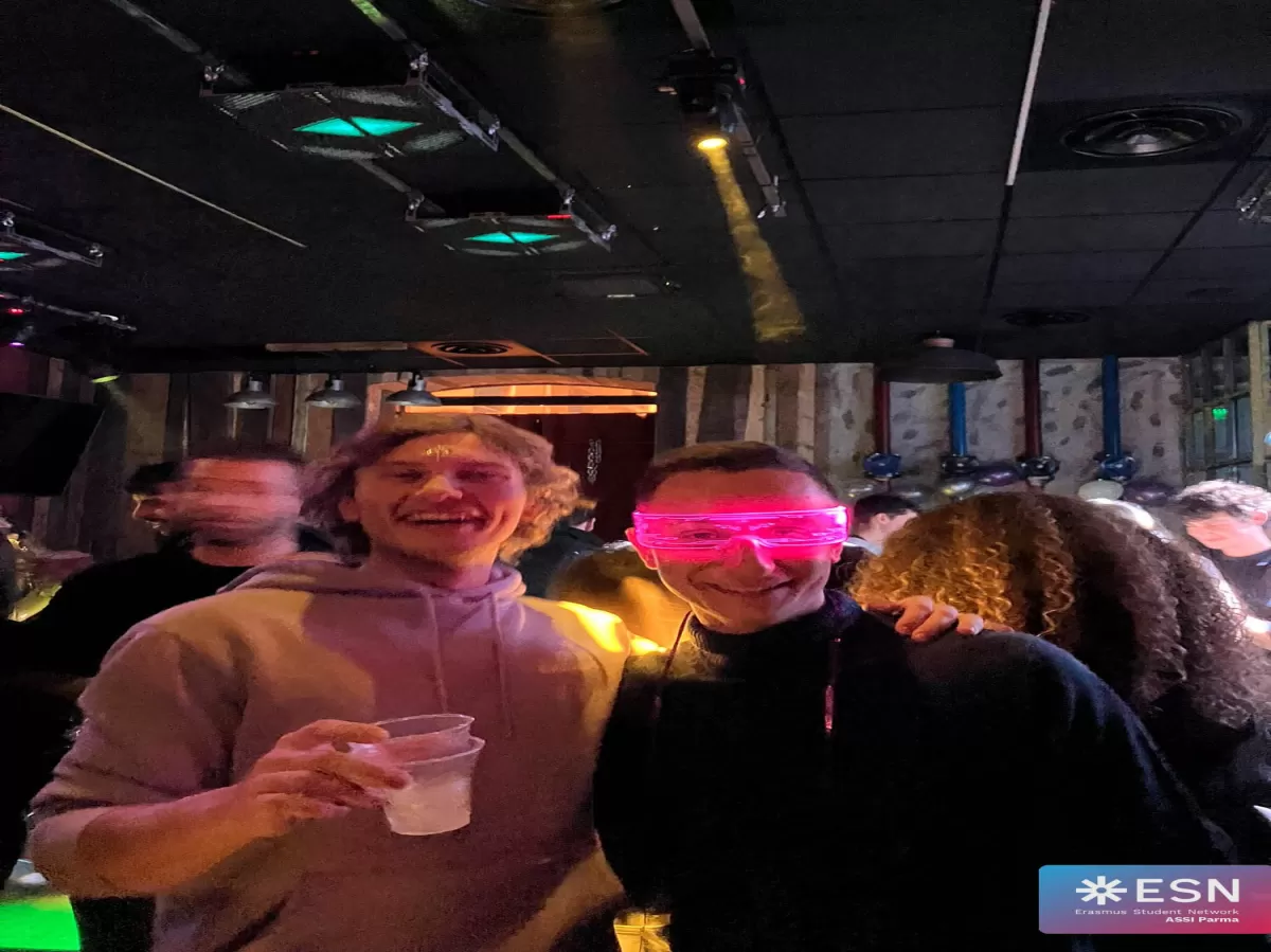 two people smiling at the party