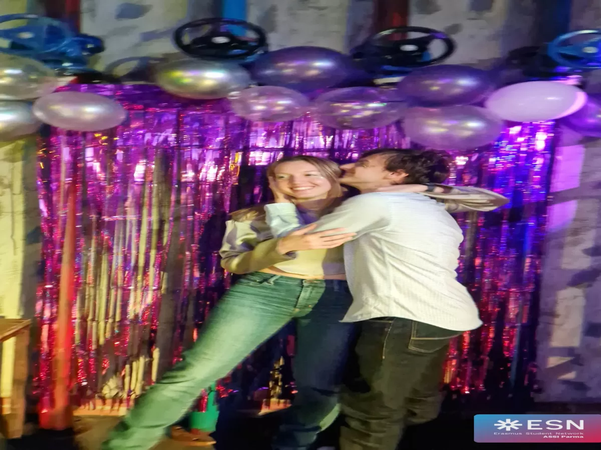 couple with the guy kissing the girl on the cheeck