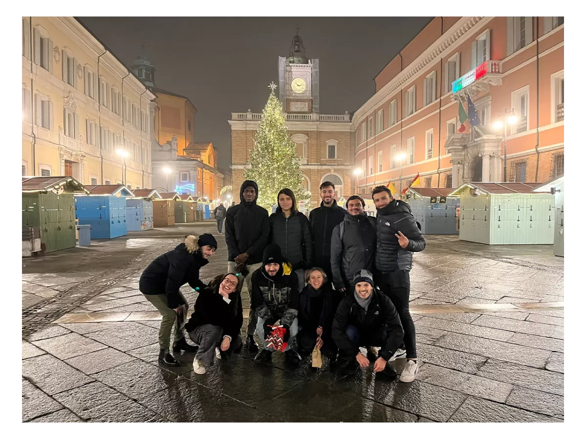 Group photo taken in the main square of Ravenna. Behind the Christmas tree and illuminations