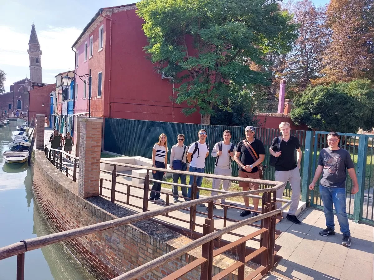 Some students and volunteers by one of the canals in Murano