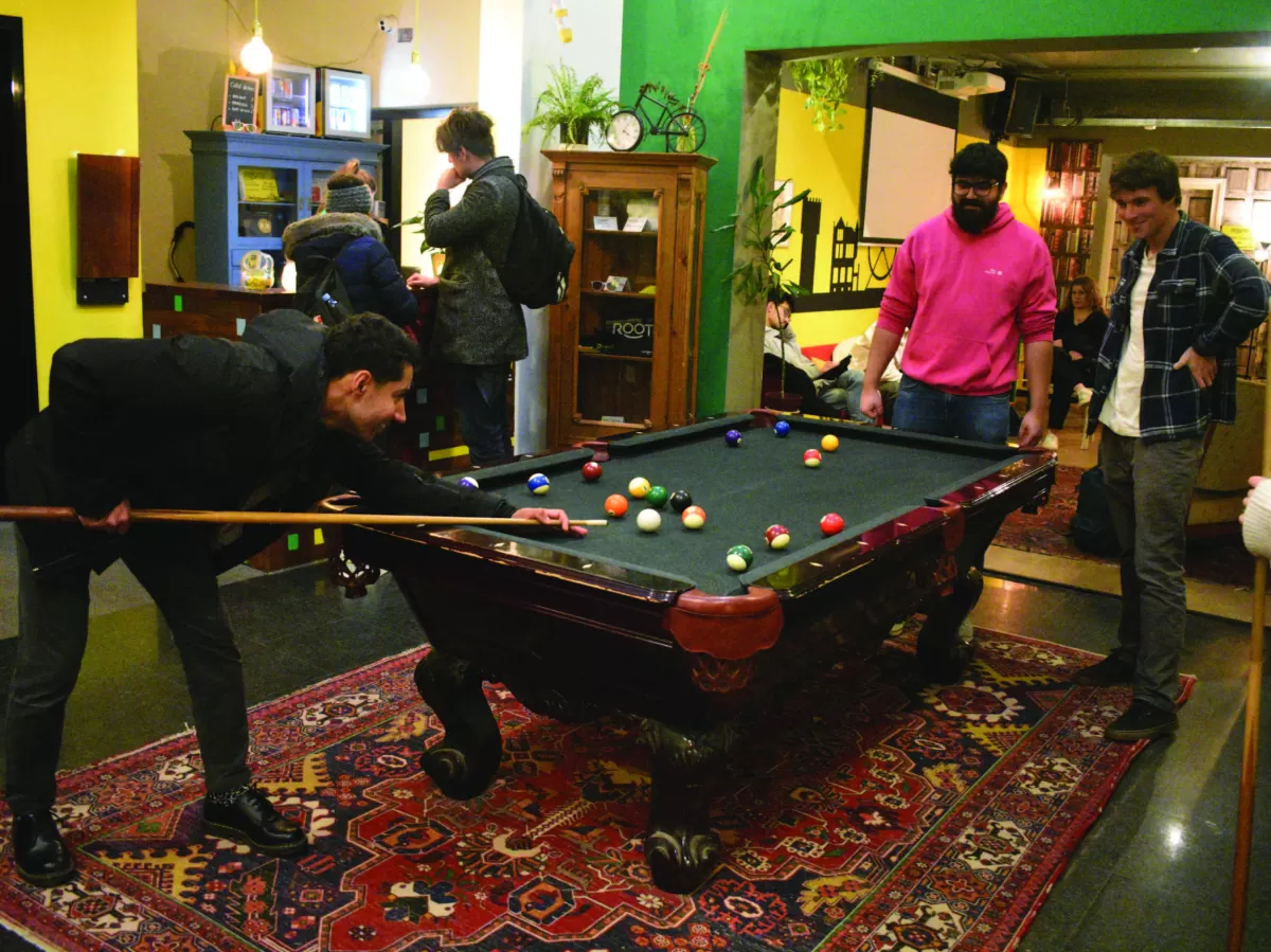 Some volunteers playing pool at the hostel