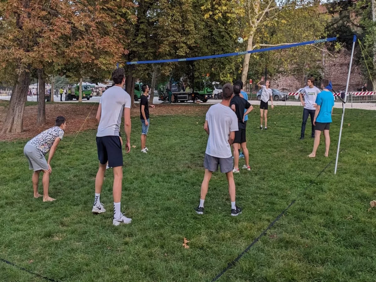 People playing volleyball in the park