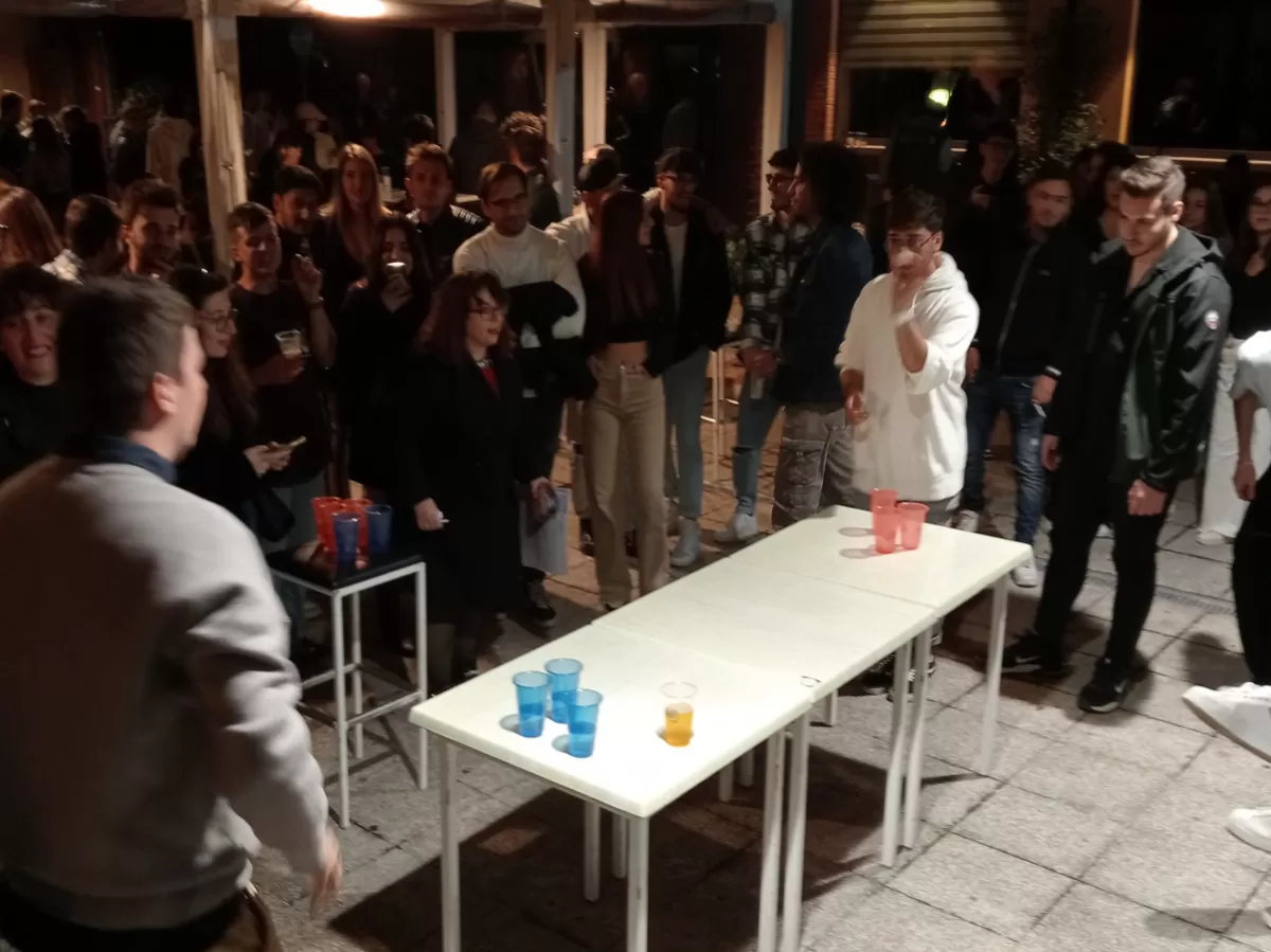 two guys having a beer pong game