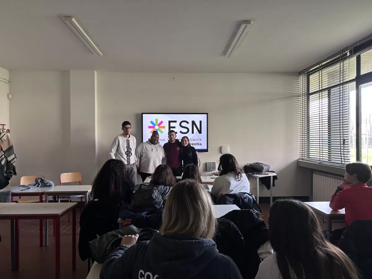 Local ESN volunteers are shown presenting the topic in front of the students