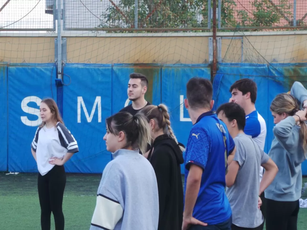 students playing on a futsal pitch