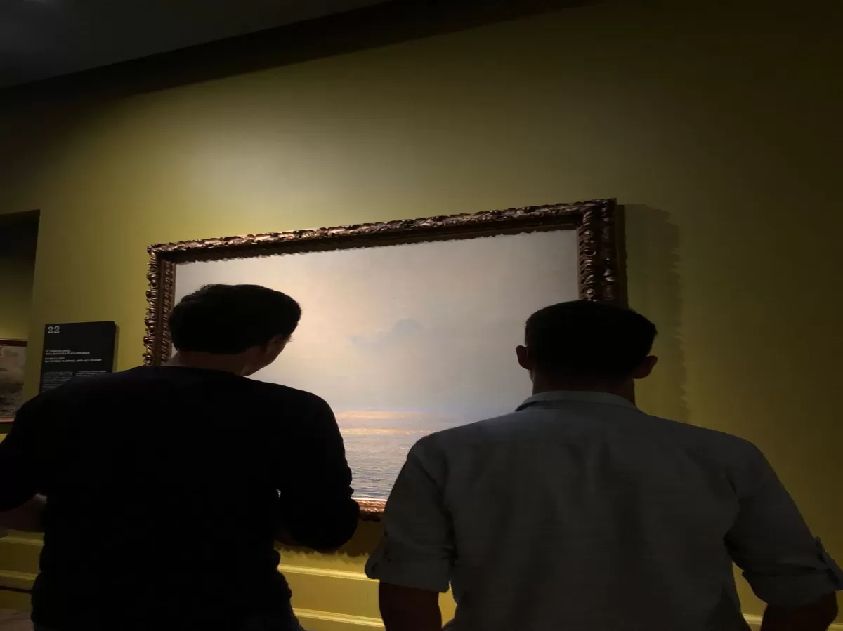 In front of a Impressionist painting