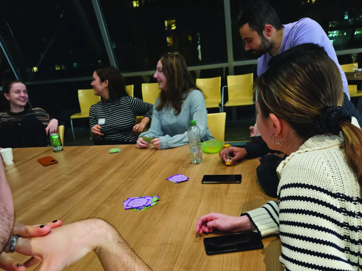 Some participants playing a card game