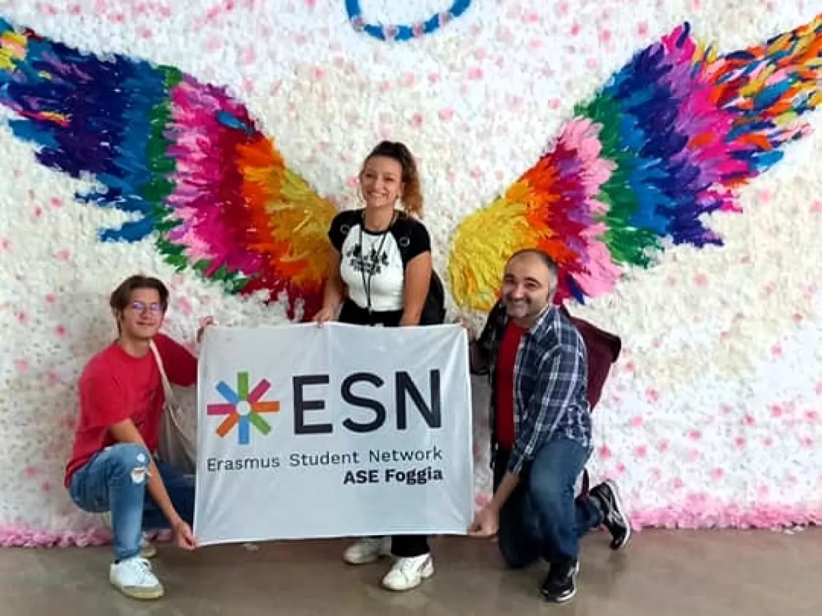 ESN volunteers posing on a wings background