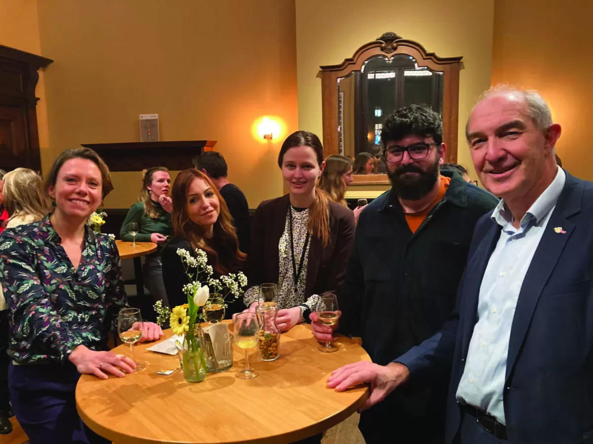 Our president posing for a picture with the chair of the executive board of Utrecht University and some other policy makers