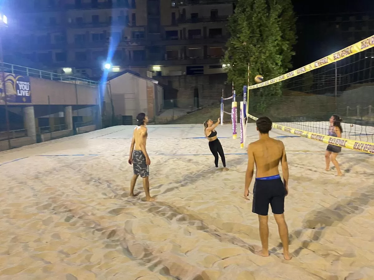 Guys playng neach volleyball
