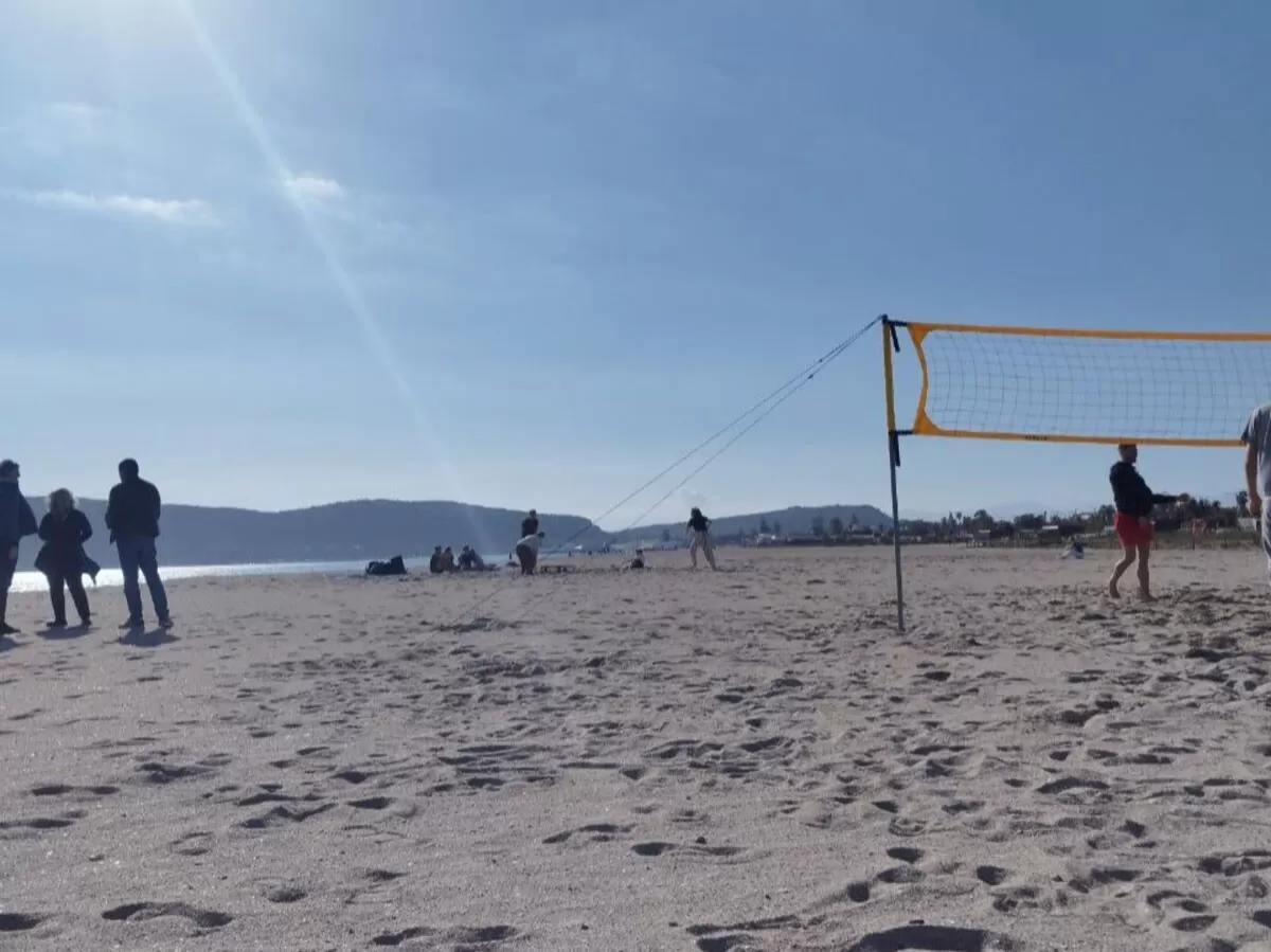 international students playing beach sports
