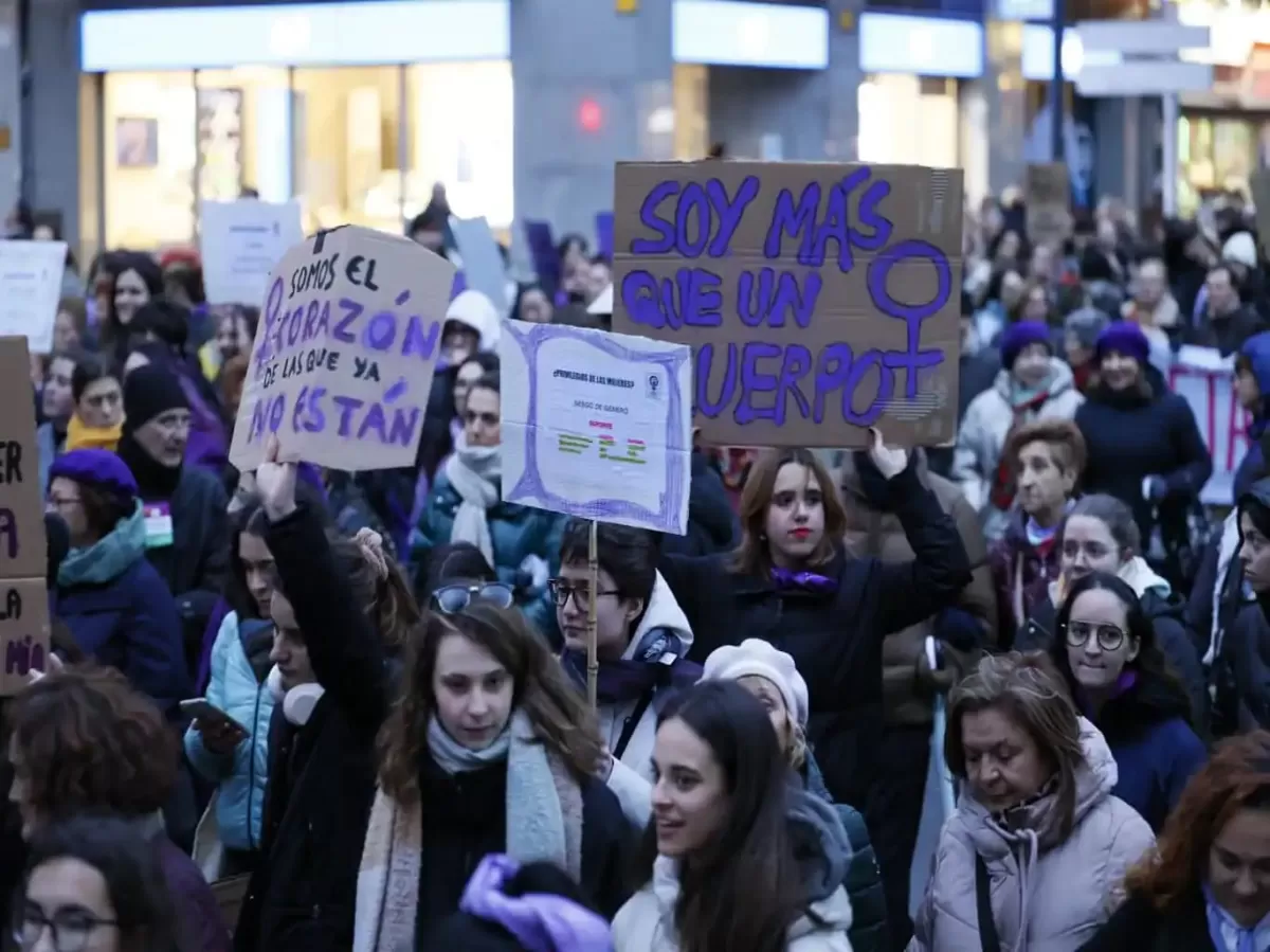 Students participating in the local demonstration of Women's Day showing their banners