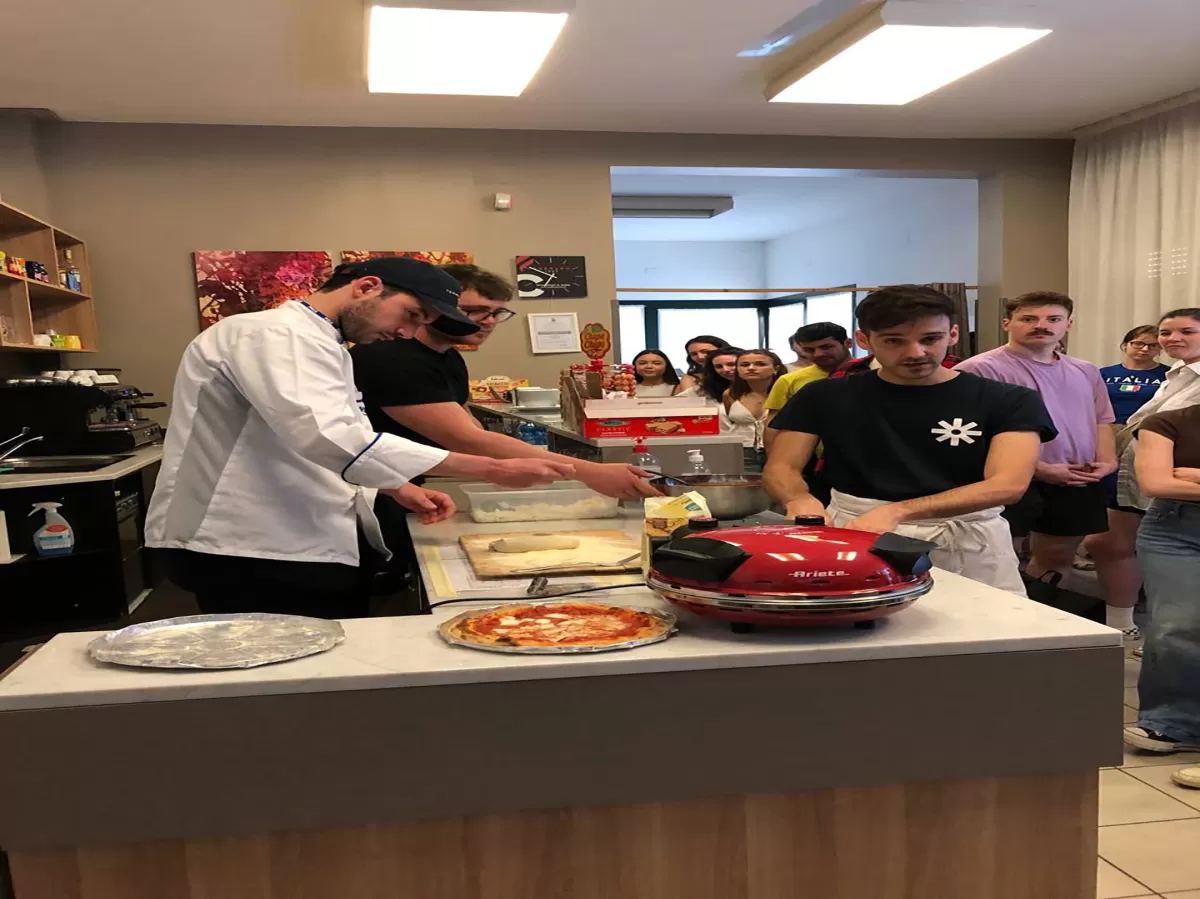 Expert teaching how to make pizza