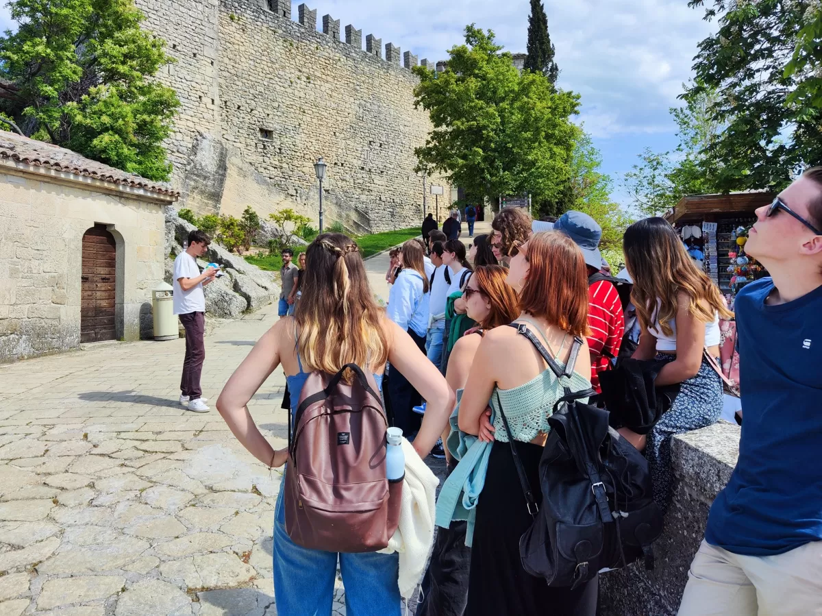 People listening to tour guide outdoors