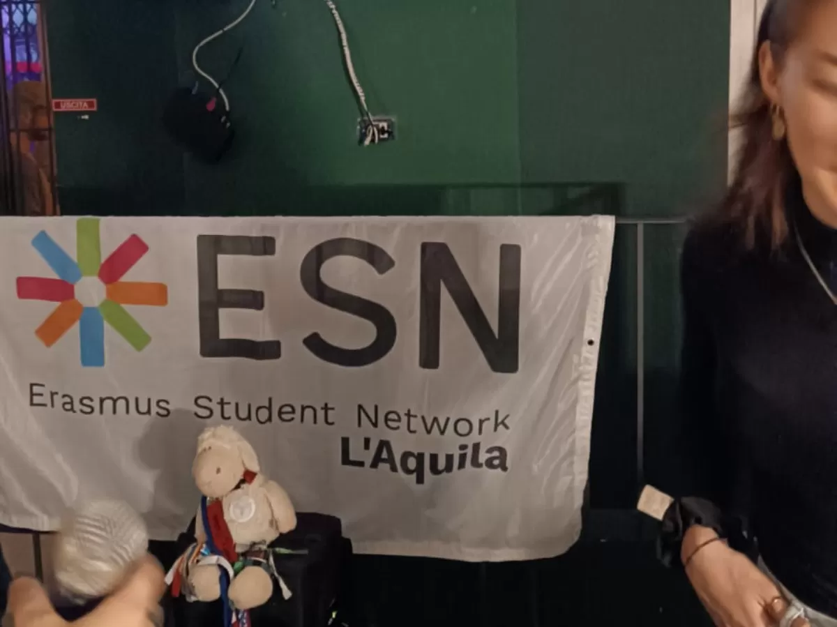 The flag of ESN L'Aquila and Dino our mascotte