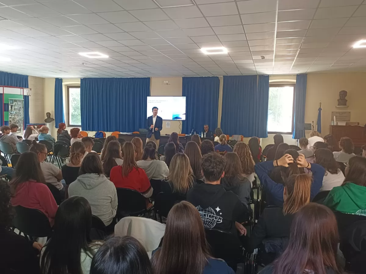 Volunteer talking to school pupils